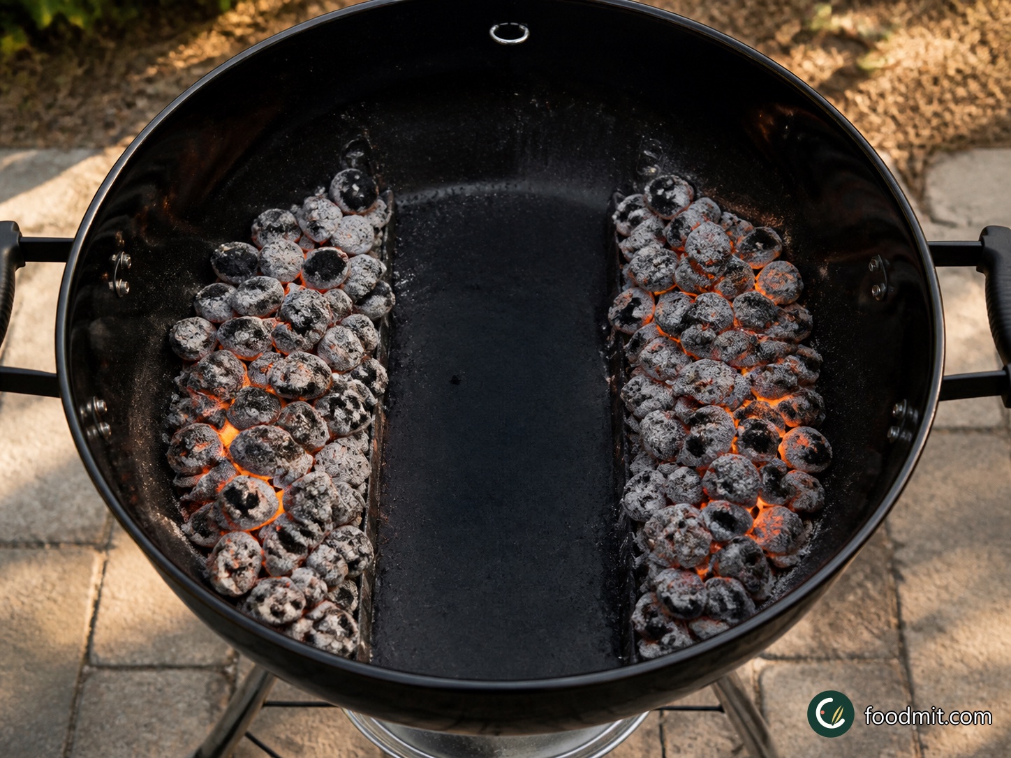 Light the charcoal and arrange it in two even banks at opposite sides of the barbecue, leaving a wide strip in the center with no coals beneath it. This middle channel is the indirect, cooler zone where the chicken will cook. Put the lid on with the vents open so the grill can heat evenly while you start the sauce.