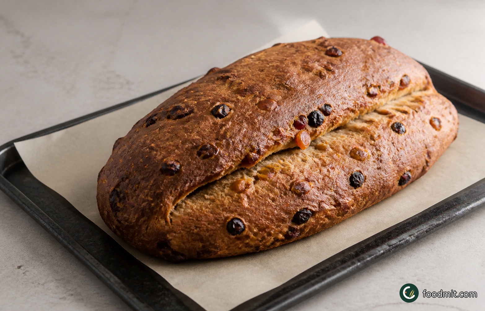 Preheat the oven to 180°C (gas mark 4). Once it is fully heated, remove the bag and bake the stollen in the centre of the oven for 40 minutes. The loaf should be well risen and deeply golden; a fairly dark crust is normal, but if it is browning too aggressively, check that the oven is not running hot.
