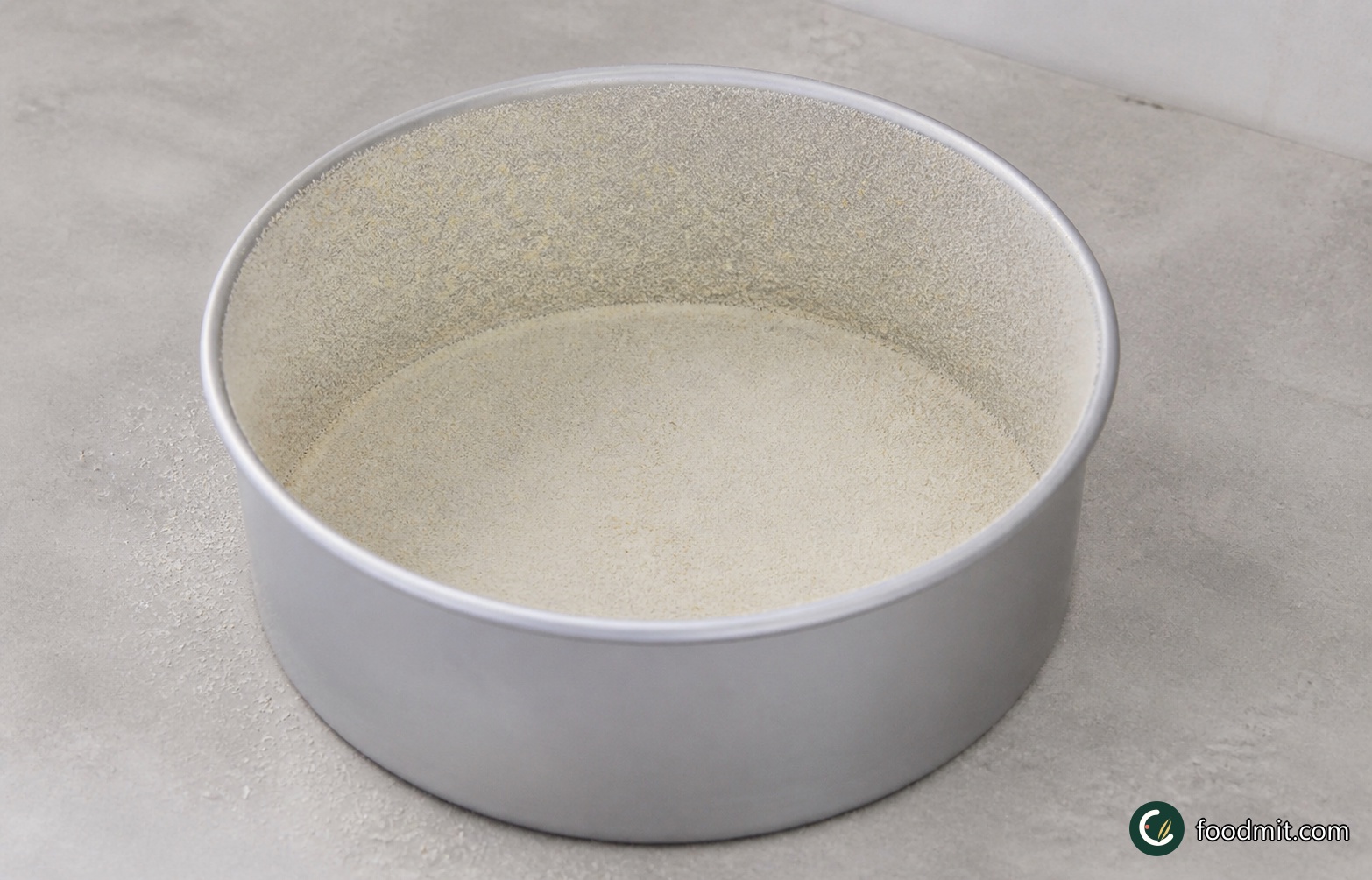 Heat the oven to 180°C/350°F/Gas 4 and position a rack in the center. Generously grease a 20 cm (8-inch) loose-based round cake tin with the extra butter. Add the breadcrumbs, turn and shake the tin until the base and sides are evenly coated, then tap out the excess.